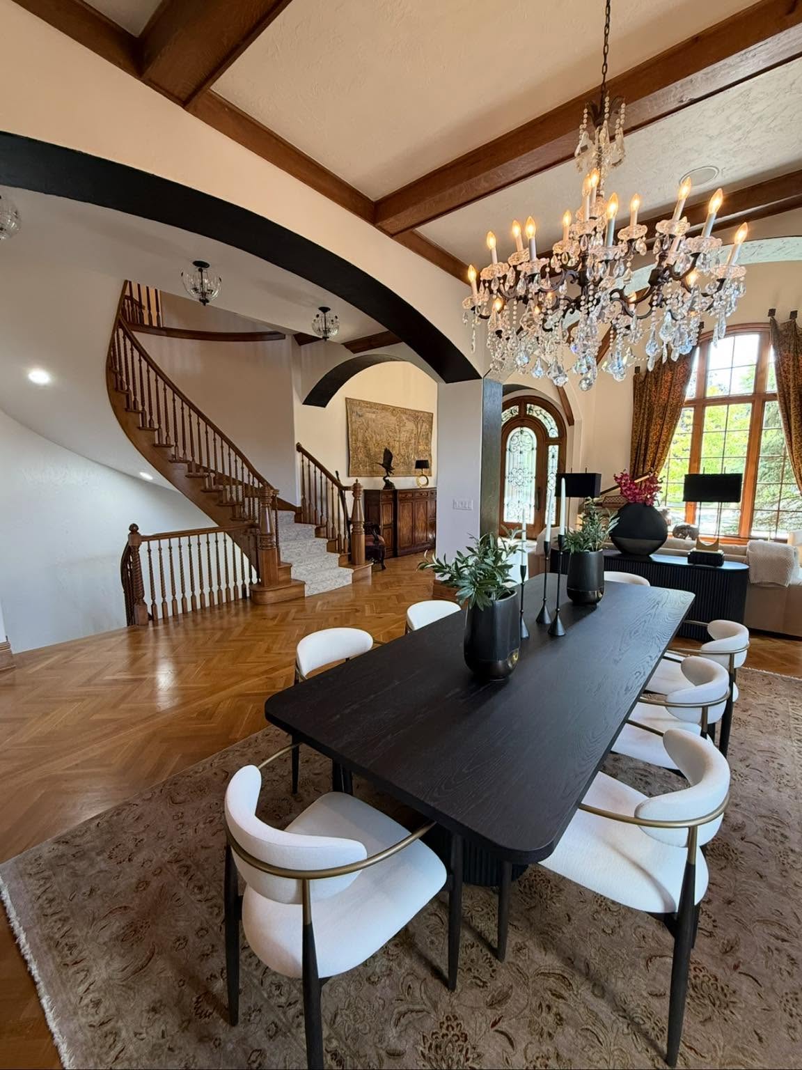 Renovated dining room with custom staircase and trim