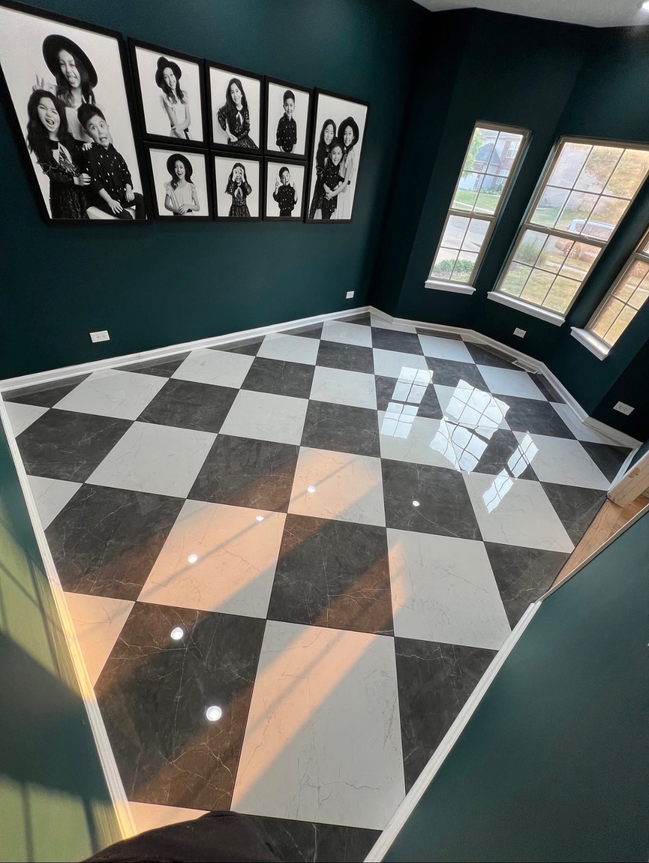 Custom black and white checkered marble tile flooring installation